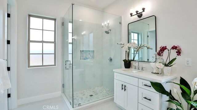 17413 Siena Ln, Fountain Valley, CA 92708 - bathroom featuring vanity, a stall shower, and plenty of natural light