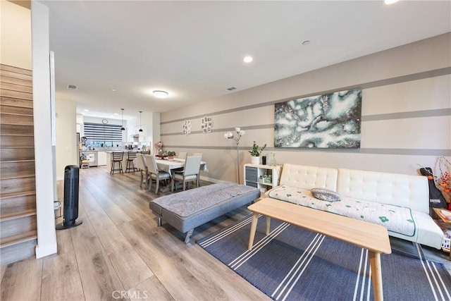 9044 Garvey Ave Unit 21, Rosemead, CA 91770 - living area with light wood finished floors, stairway, and recessed lighting