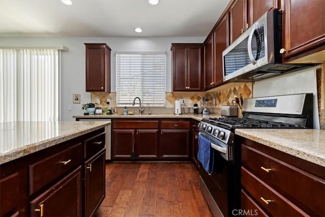 10349 Cooks Dr Unit 2, Rancho Cucamonga, CA 91730 - kitchen with stainless steel appliances, dark wood-style floors, decorative backsplash, light stone counters, and recessed lighting