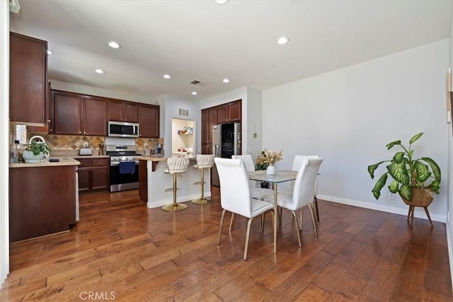 10349 Cooks Dr Unit 2, Rancho Cucamonga, CA 91730 - dining space featuring dark wood-style flooring and recessed lighting