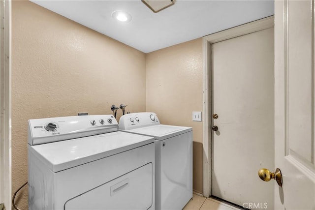 1549 Hillcrest Dr, Pomona, CA 91768 - laundry room with washer and dryer and a textured wall