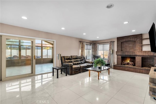 1549 Hillcrest Dr, Pomona, CA 91768 - living area with light tile patterned floors, recessed lighting, and a brick fireplace