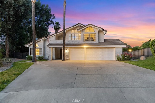 1549 Hillcrest Dr, Pomona, CA 91768 - traditional-style house with a garage and driveway