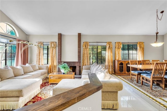1549 Hillcrest Dr, Pomona, CA 91768 - living room featuring lofted ceiling, tile patterned floors, and a brick fireplace