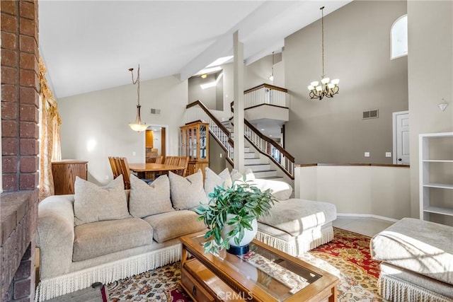 1549 Hillcrest Dr, Pomona, CA 91768 - living room featuring high vaulted ceiling, stairs, and a chandelier