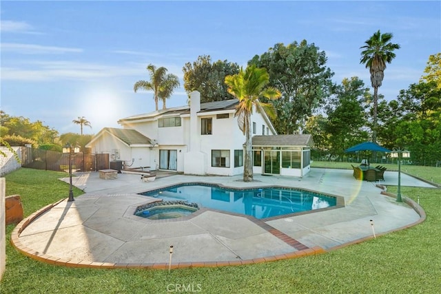 1549 Hillcrest Dr, Pomona, CA 91768 - view of swimming pool with a sunroom, a patio, a fenced backyard, and a pool with connected hot tub