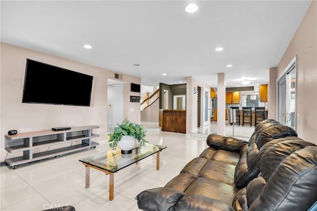 1549 Hillcrest Dr, Pomona, CA 91768 - living room featuring light tile patterned flooring, recessed lighting, and stairway
