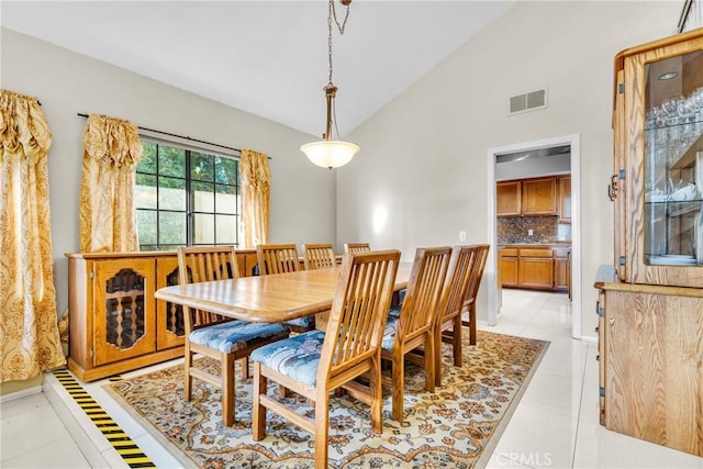 1549 Hillcrest Dr, Pomona, CA 91768 - dining space featuring light tile patterned flooring and high vaulted ceiling