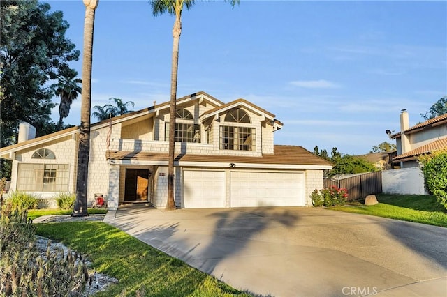 1549 Hillcrest Dr, Pomona, CA 91768 - view of front of house featuring concrete driveway and an attached garage
