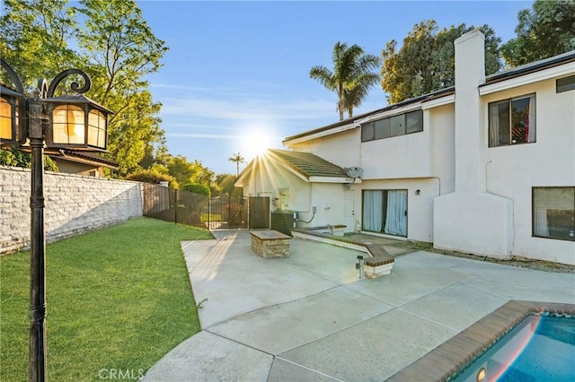 1549 Hillcrest Dr, Pomona, CA 91768 - back of house with a patio, stucco siding, and a fire pit