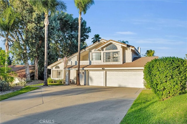 1549 Hillcrest Dr, Pomona, CA 91768 - view of front of property featuring concrete driveway and an attached garage