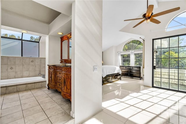 1549 Hillcrest Dr, Pomona, CA 91768 - ensuite bathroom with vanity, tile patterned floors, lofted ceiling, a garden tub, and ceiling fan