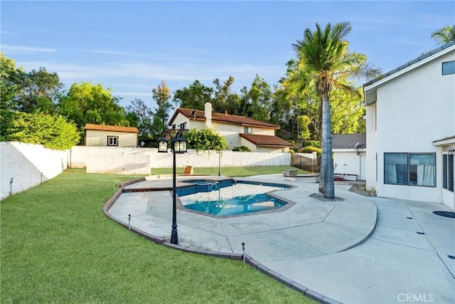 1549 Hillcrest Dr, Pomona, CA 91768 - view of pool with a fenced backyard, a patio, a pool with connected hot tub, and an outdoor structure