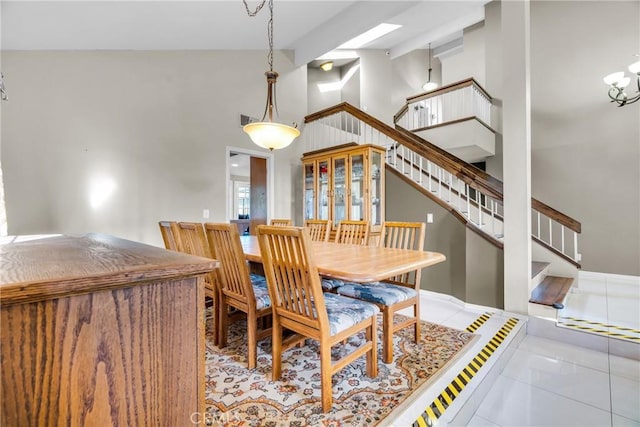 1549 Hillcrest Dr, Pomona, CA 91768 - dining area featuring stairway, high vaulted ceiling, and tile patterned floors