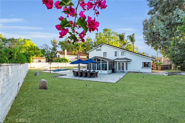 1549 Hillcrest Dr, Pomona, CA 91768 - back of house with a patio area, stucco siding, and a sunroom