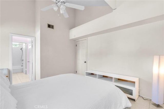 1549 Hillcrest Dr, Pomona, CA 91768 - tiled bedroom with a towering ceiling, ceiling fan, and connected bathroom