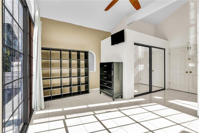 1549 Hillcrest Dr, Pomona, CA 91768 - empty room with a ceiling fan, light tile patterned flooring, and high vaulted ceiling