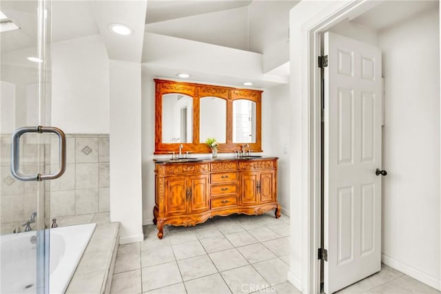 1549 Hillcrest Dr, Pomona, CA 91768 - full bathroom featuring tiled bath, double vanity, recessed lighting, a shower with shower door, and tile patterned flooring