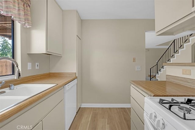 675 S College Ave, Claremont, CA 91711 - kitchen featuring white appliances, light wood-type flooring, and white cabinets