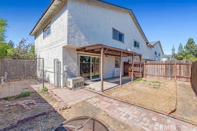 675 S College Ave, Claremont, CA 91711 - back of property featuring stucco siding, a patio area, and a fenced backyard