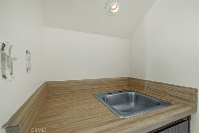 675 S College Ave, Claremont, CA 91711 - bathroom with a sink and vaulted ceiling