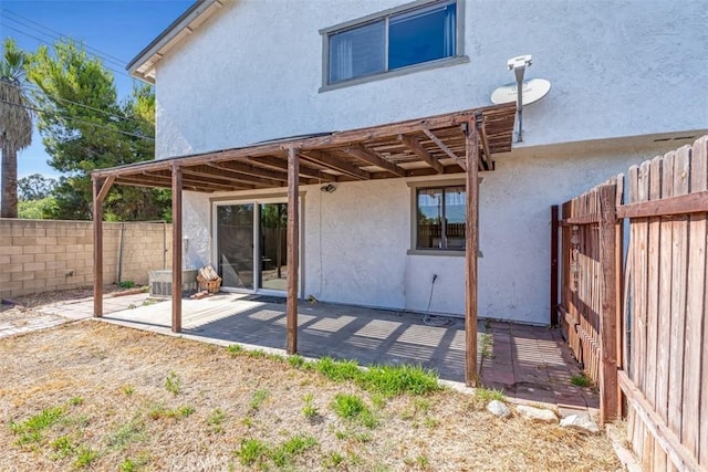 675 S College Ave, Claremont, CA 91711 - back of house featuring stucco siding, a fenced backyard, and a patio