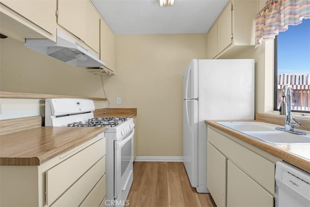 675 S College Ave, Claremont, CA 91711 - kitchen with white appliances, light wood-style flooring, under cabinet range hood, and light countertops