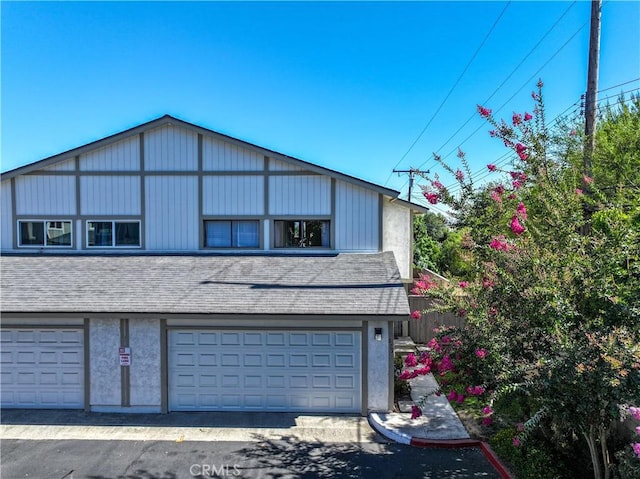 675 S College Ave, Claremont, CA 91711 - view of front of house featuring a garage and a shingled roof