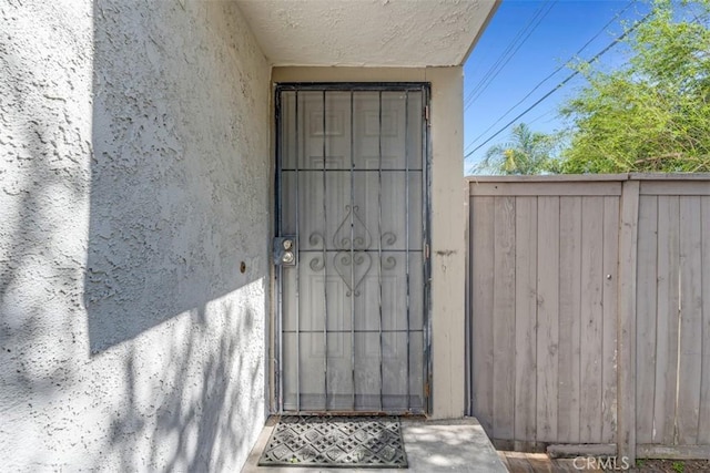 675 S College Ave, Claremont, CA 91711 - doorway to property with stucco siding
