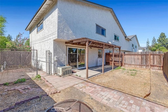 675 S College Ave, Claremont, CA 91711 - rear view of property with stucco siding, a patio area, and a fenced backyard