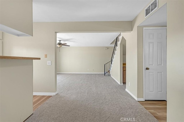 675 S College Ave, Claremont, CA 91711 - hall featuring stairway, carpet flooring, and wood finished floors