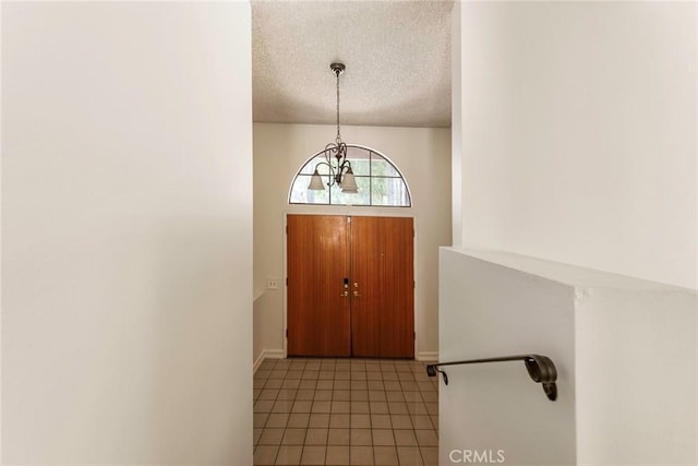 6157 Hillary Ct, Riverside, CA 92506 - foyer with a textured ceiling, a chandelier, and tile patterned flooring