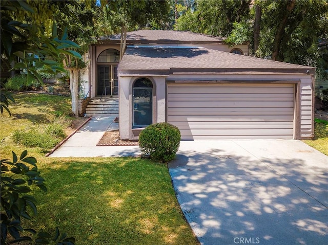 6157 Hillary Ct, Riverside, CA 92506 - view of front of house featuring a shingled roof, an attached garage, driveway, and a front yard