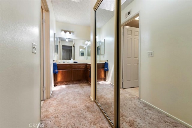 6157 Hillary Ct, Riverside, CA 92506 - bathroom featuring vanity and a textured ceiling
