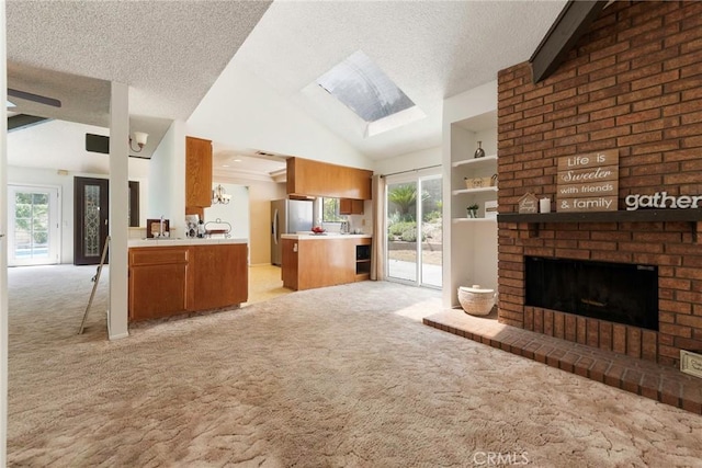 6157 Hillary Ct, Riverside, CA 92506 - unfurnished living room featuring light carpet, lofted ceiling, plenty of natural light, a textured ceiling, and a brick fireplace