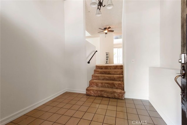 6157 Hillary Ct, Riverside, CA 92506 - entrance foyer featuring light tile patterned flooring, stairs, and ceiling fan