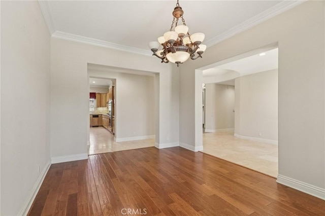 16860 Rayen St, Northridge, CA 91343 - empty room featuring a chandelier, hardwood / wood-style flooring, and ornamental molding
