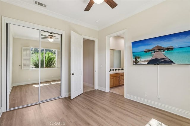 16860 Rayen St, Northridge, CA 91343 - unfurnished bedroom featuring light wood-style flooring, ornamental molding, a closet, ceiling fan, and connected bathroom