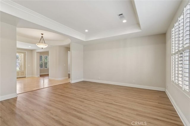 16860 Rayen St, Northridge, CA 91343 - unfurnished room with light wood-type flooring, healthy amount of natural light, a raised ceiling, recessed lighting, and arched walkways