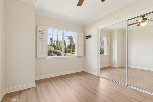 16860 Rayen St, Northridge, CA 91343 - unfurnished bedroom featuring wood finished floors, crown molding, a closet, and a ceiling fan