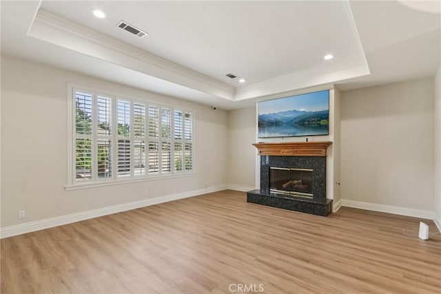 16860 Rayen St, Northridge, CA 91343 - unfurnished living room featuring a raised ceiling, light wood finished floors, crown molding, recessed lighting, and a high end fireplace