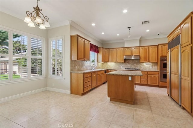 16860 Rayen St, Northridge, CA 91343 - kitchen featuring plenty of natural light, decorative backsplash, ornamental molding, under cabinet range hood, and double oven