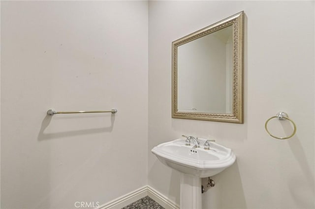 16860 Rayen St, Northridge, CA 91343 - bathroom featuring baseboards and a sink