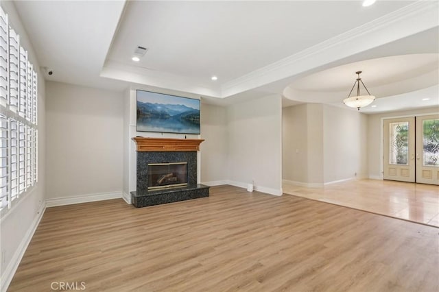 16860 Rayen St, Northridge, CA 91343 - unfurnished living room featuring a raised ceiling, light wood-style floors, recessed lighting, a premium fireplace, and crown molding