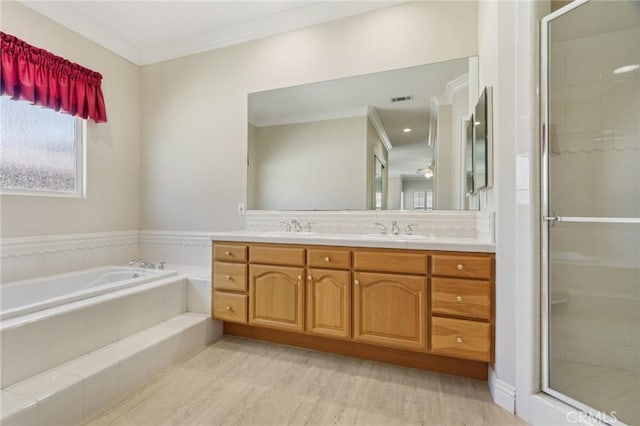 16860 Rayen St, Northridge, CA 91343 - full bath with double vanity, a bath, a shower stall, ornamental molding, and wood finished floors