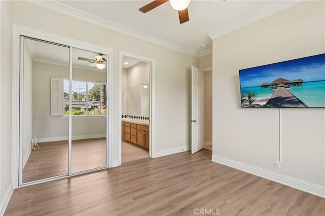 16860 Rayen St, Northridge, CA 91343 - unfurnished bedroom with light wood-style flooring, ornamental molding, connected bathroom, ceiling fan, and a closet