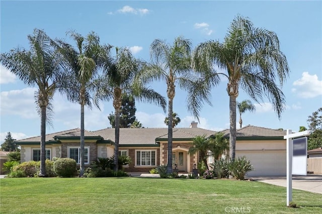 16860 Rayen St, Northridge, CA 91343 - ranch-style home with driveway, an attached garage, a front lawn, and a chimney