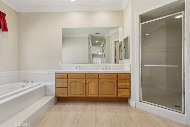 16860 Rayen St, Northridge, CA 91343 - full bathroom with double vanity, ornamental molding, a stall shower, a garden tub, and wood finished floors