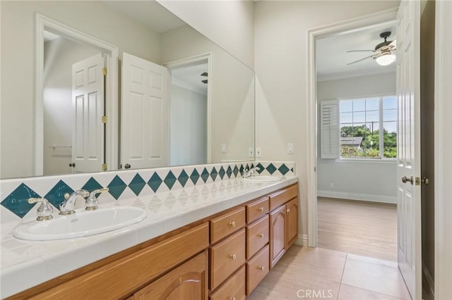 16860 Rayen St, Northridge, CA 91343 - bathroom featuring double vanity, backsplash, crown molding, tile patterned flooring, and ceiling fan