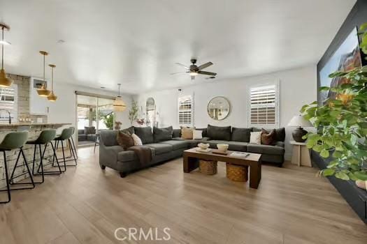 2056 Caltha Way, Perris, CA 92571 - living area featuring a ceiling fan and light wood finished floors